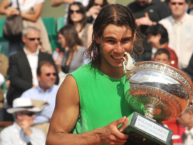 Rafael Nadal (ESP) celebrates with the trophy after winning the 2008 French Open final against Roger Federer (SUI).