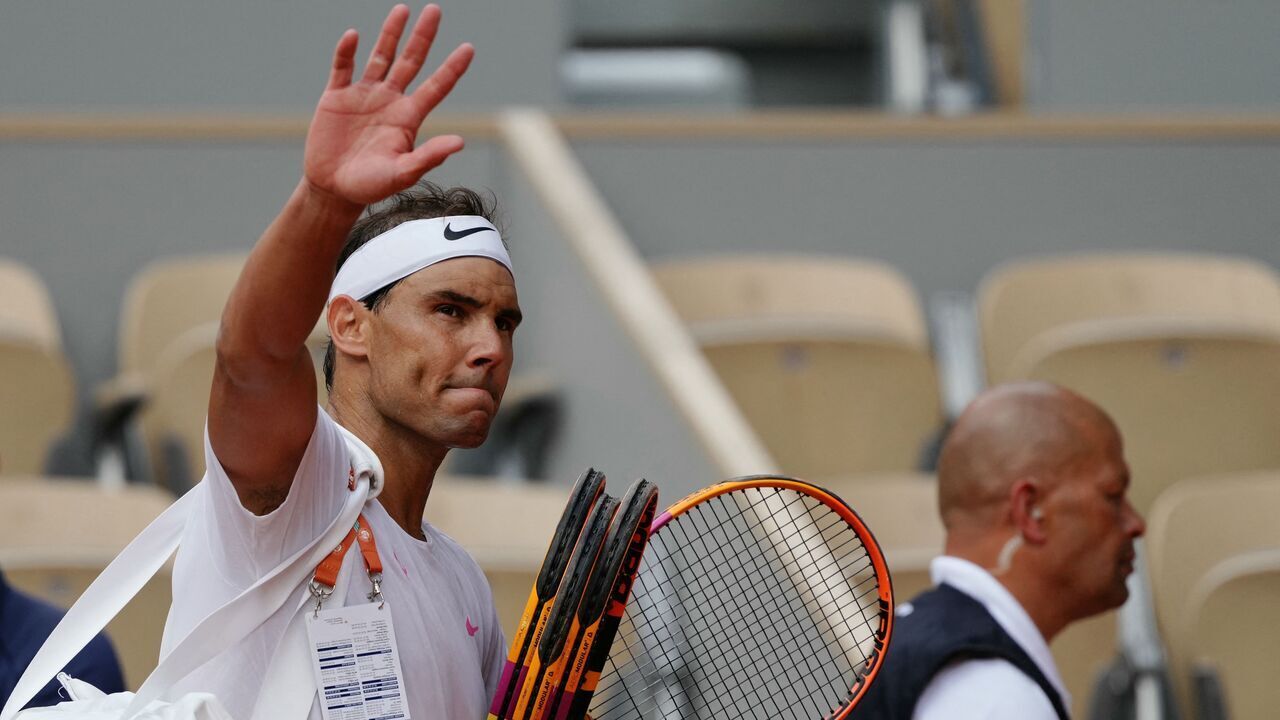 Spain's Rafael Nadal waves to spectators as he leaves the court after taking part in a practice session ahead of The French Open tennis tournament on Court Philippe-Chatrier at The Roland Garros Complex in Paris on May 21, 2024.
