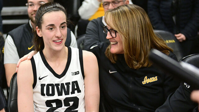 IOWA CITY, IA - FEBRUARY 26: Iowa guard Caitlin Clark (22) takes break with Jenni Fitzgerald, special assistant to the head coach, after winning a women's college basketball game between the Indiana Hoosiers and the Iowa Hawkeyes on February 26, 2023, at Carver-Hawkeye Arena in Iowa City, IA