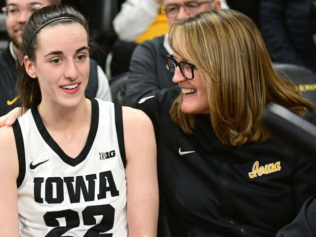 IOWA CITY, IA - FEBRUARY 26: Iowa guard Caitlin Clark (22) takes break with Jenni Fitzgerald, special assistant to the head coach, after winning a women's college basketball game between the Indiana Hoosiers and the Iowa Hawkeyes on February 26, 2023, at Carver-Hawkeye Arena in Iowa City, IA