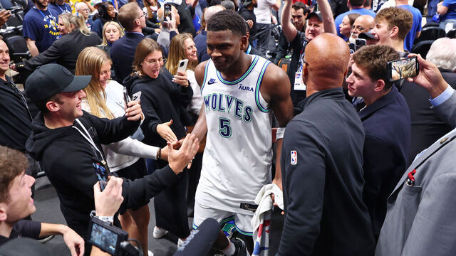 DENVER, COLORADO - MAY 19: Anthony Edwards #5 of the Minnesota Timberwolves high fives fans after defeating the Denver Nuggets in Game Seven of the Western Conference Second Round Playoffs at Ball Arena on May 19, 2024 in Denver, Colorado.