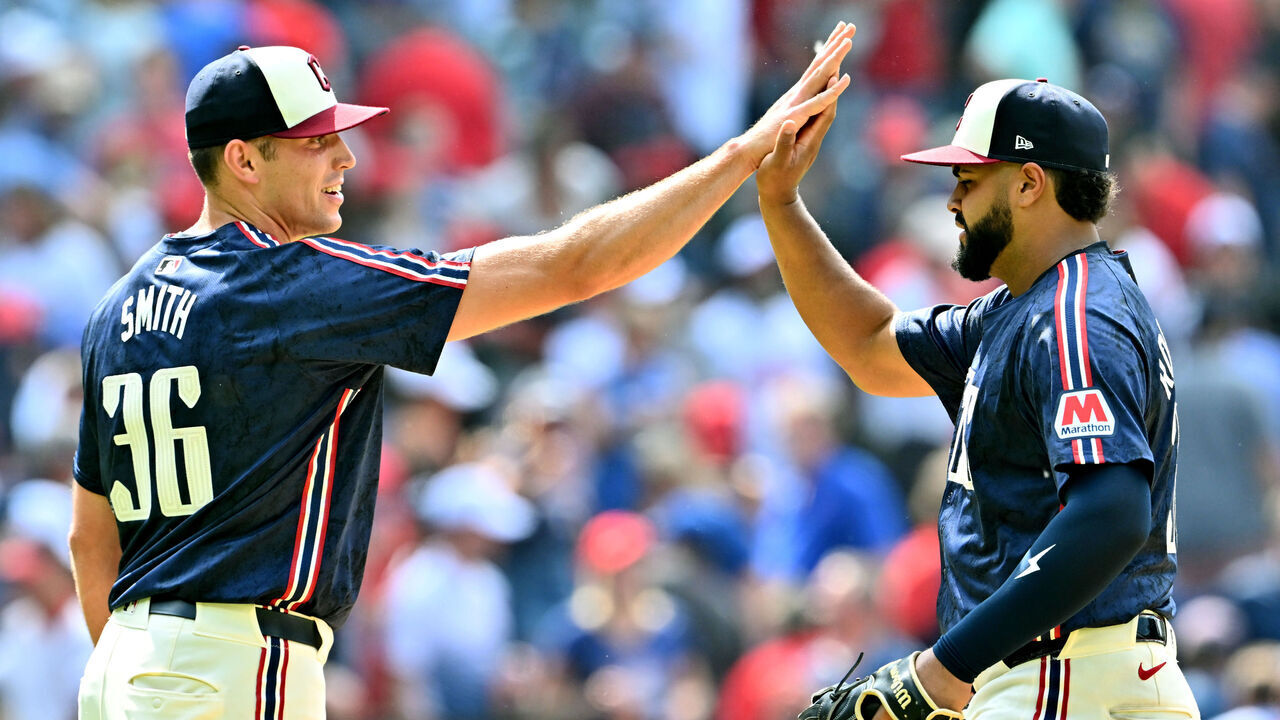CLEVELAND, OHIO - MAY 22: Closing pitcher Cade Smith #36 celebrates with Johnathan Rodriguez #30 of the Cleveland Guardians after the Guardians defeated the New York Mets at Progressive Field on May 22, 2024 in Cleveland, Ohio. The Guardians defeated the Mets 6-3.