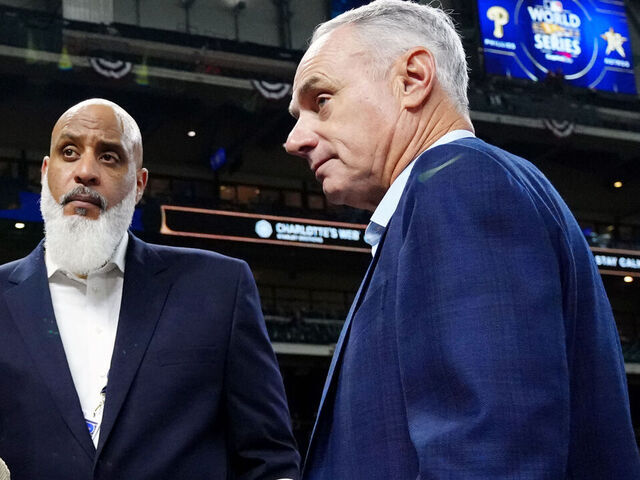 HOUSTON, TX - OCTOBER 29: Executive Director of the Major League Baseball Players Association Tony Clark and Major League Baseball Commissioner Robert D. Manfred Jr. look on during batting practice prior to Game 2 of the 2022 World Series between the Philadelphia Phillies and the Houston Astros at Minute Maid Park on Saturday, October 29, 2022 in Houston, Texas.
