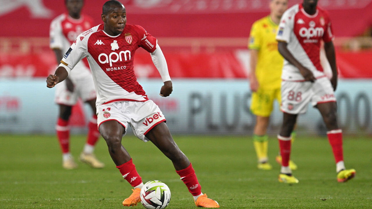 Monaco's Malian midfielder #04 Mohamed Camara (L) passes the ball during the French L1 football match between AS Monaco and FC Nantes at the Louis II Stadium (Stade Louis II) in the Principality of Monaco on May 19, 2024.