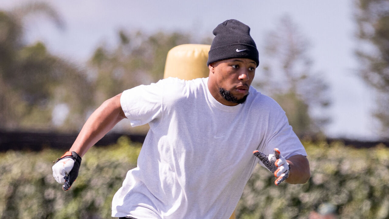 ORANGE COUNTY, CA - MARCH 28: Quarterback Jalen Hurts of the Philadelphia Eagles looks to throw the ball to Running Back Saquon Barkley also of the Philadelphia Eagles during a quarterback camp during the off-season in Southern California on March 28, 2024 in Orange County, CA.