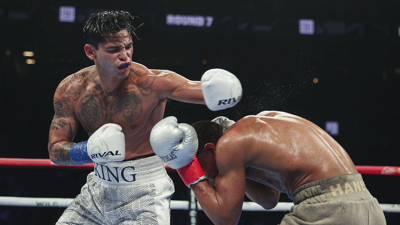 NEW YORK, NEW YORK - APRIL 20: Ryan Garcia lands a punch on Devin Haney during a fight at Barclays Center on April 20, 2024 in New York City.