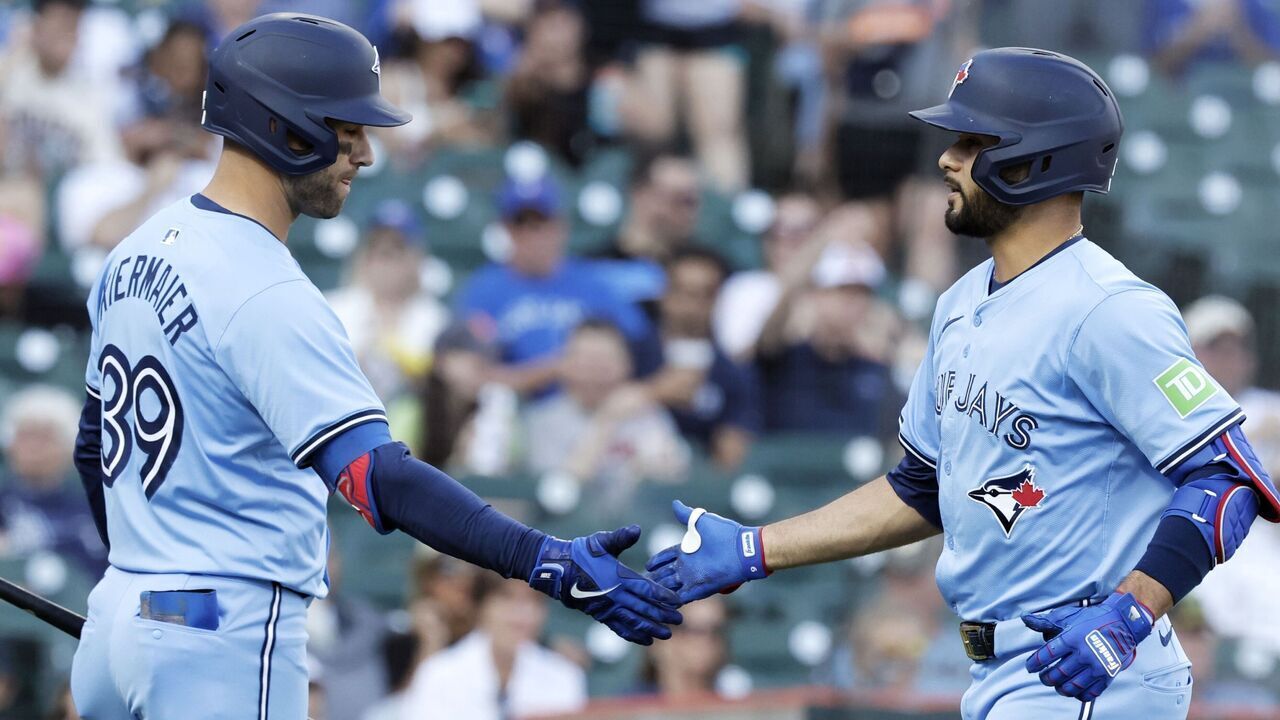 DETROIT, MI - MAY 23: Isiah Kiner-Falefa #7 of the Toronto Blue Jays is congratulated by Kevin Kiermaier #39 after hitting a solo home run against the Detroit Tigers during the third inning at Comerica Park on May 23, 2024 in Detroit, Michigan.