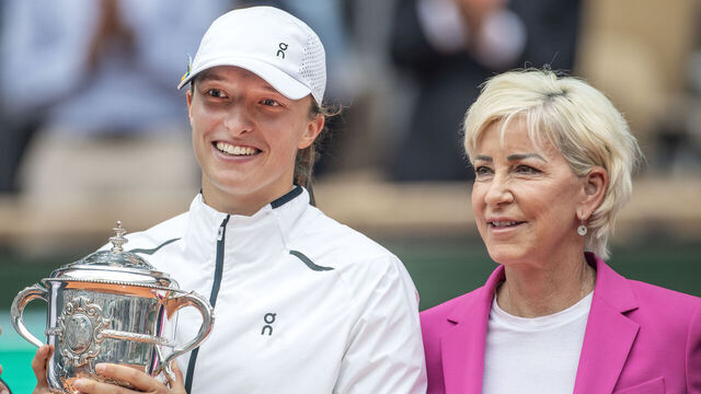 PARIS, FRANCE - JUNE 10. Iga Swiatek of Poland with the winner's trophy received from Chris Evert after her victory against Karolina Muchova of the Czech Republic in the Women's Singles Final on Court Philippe Chatrier during the 2023 French Open Tennis Tournament at Roland Garros on June 10, 2023, in Paris, France.