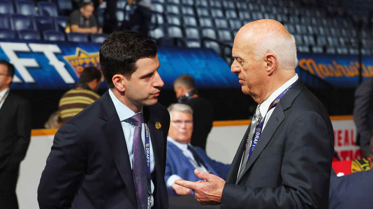 NASHVILLE, TENNESSEE - JUNE 29: (L-R) Kyle Davidson of the Chicago Blackhawks chats with Lou Lamoriello of the New York Islanders at the 2023 NHL Draft at the Bridgestone Arena on June 29, 2023 in Nashville, Tennessee.