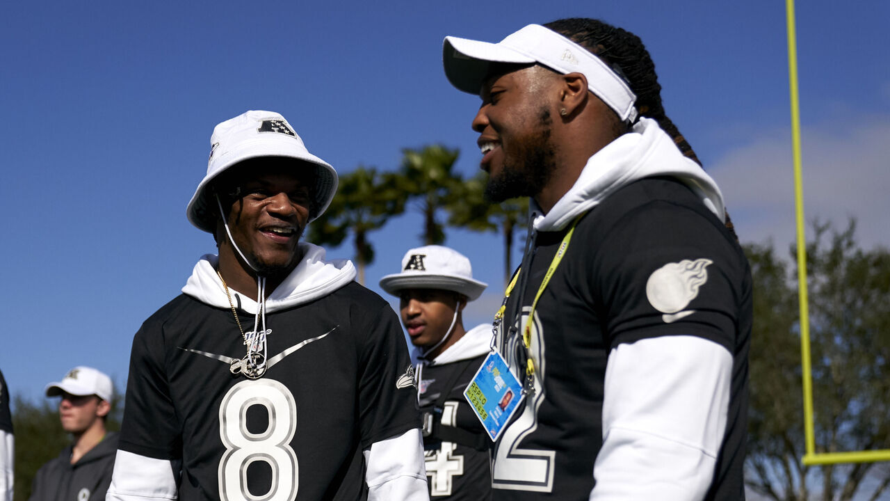 KISSIMMEE, FLORIDA - JANUARY 22: Lamar Jackson #8 of the Baltimore Ravens visits with Derrick Henry #22 of the Tennessee Titans during the AFC team practice in preparation for the 2020 Pro Bowl, Wednesday, Jan. 22, 2020, in Kissimmee, Florida.