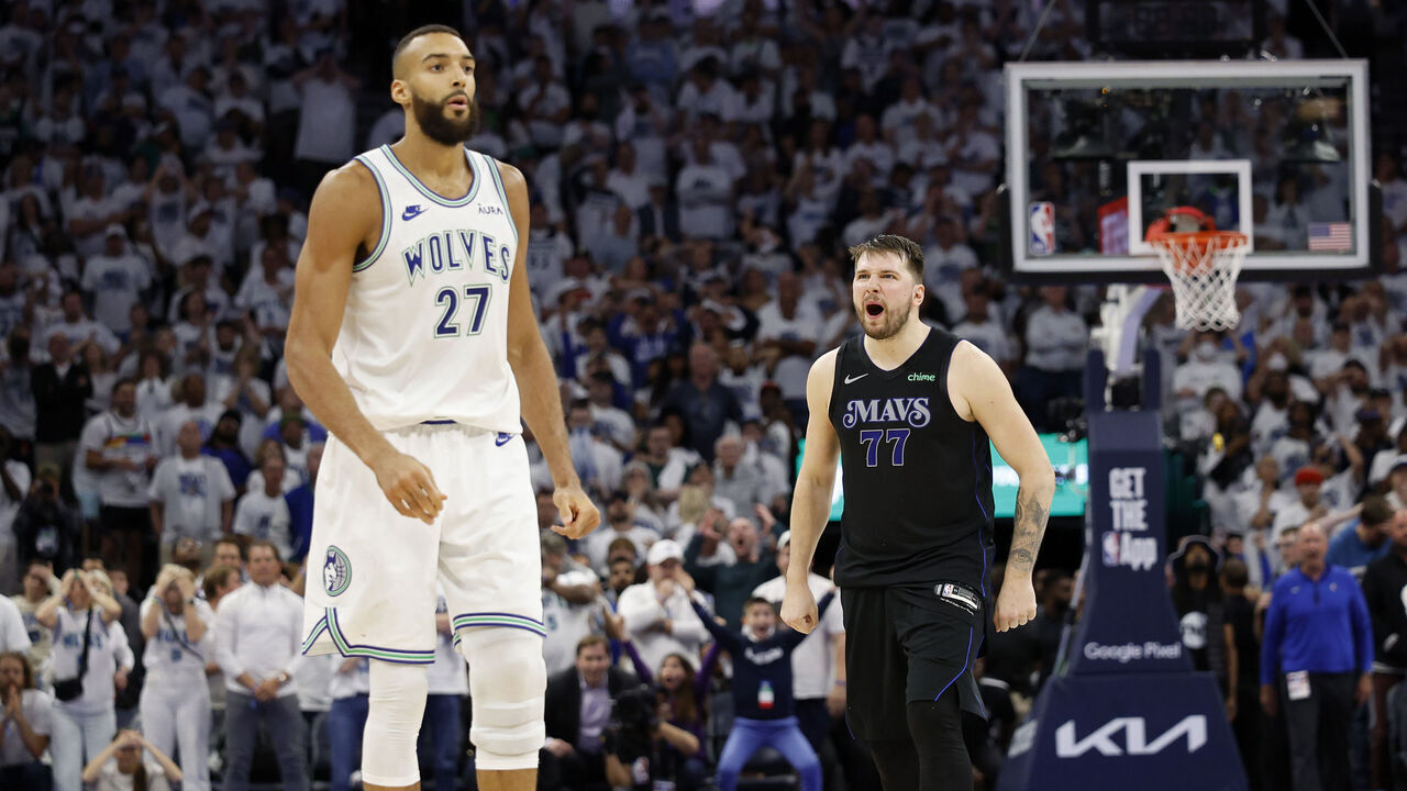 MINNEAPOLIS, MINNESOTA - MAY 24: Luka Doncic #77 of the Dallas Mavericks celebrates a three point basket during the fourth quarter against Rudy Gobert #27 of the Minnesota Timberwolves in Game Two of the Western Conference Finals at Target Center on May 24, 2024 in Minneapolis, Minnesota.