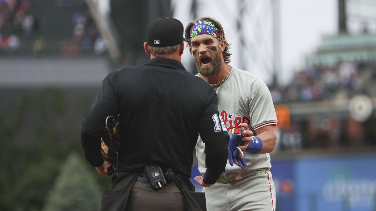 DENVER, COLORADO - MAY 24:Bryce Harper #3 of the Philadelphia Phillies argues with umpire Bruce Dreckman #1 after being ejected during the first inning of the game against the Colorado Rockies at Coors Field on May 24, 2024 in Denver, Colorado.
