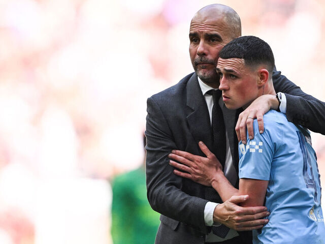 TOPSHOT - Manchester City's Spanish manager Pep Guardiola consols Manchester City's English midfielder #47 Phil Foden after loosing the English FA Cup final football match between Manchester City and Manchester United at Wembley stadium, in London, on May 25, 2024. Manchester United wins 2 - 1 against Manchester City.