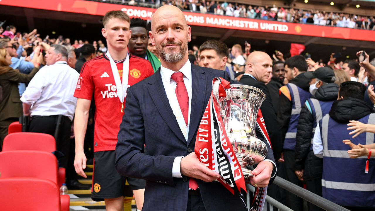 LONDON, ENGLAND - MAY 25: Erik ten Hag, Manager of Manchester United, carries the Emirates FA Cup trophy down the stairs after the Emirates FA Cup Final match between Manchester City and Manchester United at Wembley Stadium on May 25, 2024 in London, England.