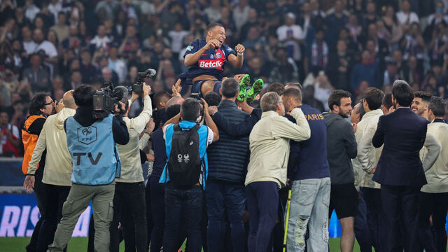 Paris Saint-Germain's French forward #07 Kylian Mbappe (C) is thrown into the air as Paris Saint-Germain's staff and players celebrate winning the French Cup Final football match against Olympique Lyonnais (OL) at the Stade Pierre-Mauroy, in Villeneuve-d'Ascq, northern France on May 25, 2024.
