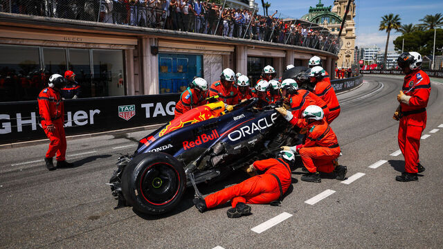 MONTE-CARLO, MONACO - MAY 26: Sergio Perez of Mexico and Oracle Red Bull Racing's car attended to by the stewards after crashing on lap one during the F1 Grand Prix of Monaco at Circuit de Monaco on May 26, 2024 in Monte-Carlo, Monaco.