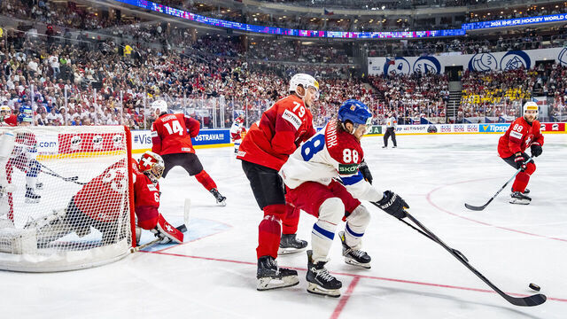 PRAGUE, CZECH REPUBLIC - MAY 26: David Pastrnak of Czechia (R) against Calvin Thurkauf of Switzerland during 2024 IIHF Ice Hockey World Championship Czechia Final match between Switzerland and Czech Republic at Prague Arena on May 26, 2024 in Prague, Czech Republic.