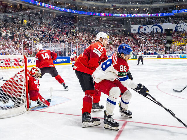 PRAGUE, CZECH REPUBLIC - MAY 26: David Pastrnak of Czechia (R) against Calvin Thurkauf of Switzerland during 2024 IIHF Ice Hockey World Championship Czechia Final match between Switzerland and Czech Republic at Prague Arena on May 26, 2024 in Prague, Czech Republic.