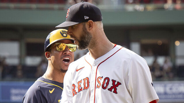 BOSTON, MA - MAY 26: Quintin Berry #33 of the Milwaukee Brewers and Chris Martin #55 of the Boston Red Sox exchange words leading to the benches clearing during the seventh inning of a game on May 26, 2024 at Fenway Park in Boston, Massachusetts.