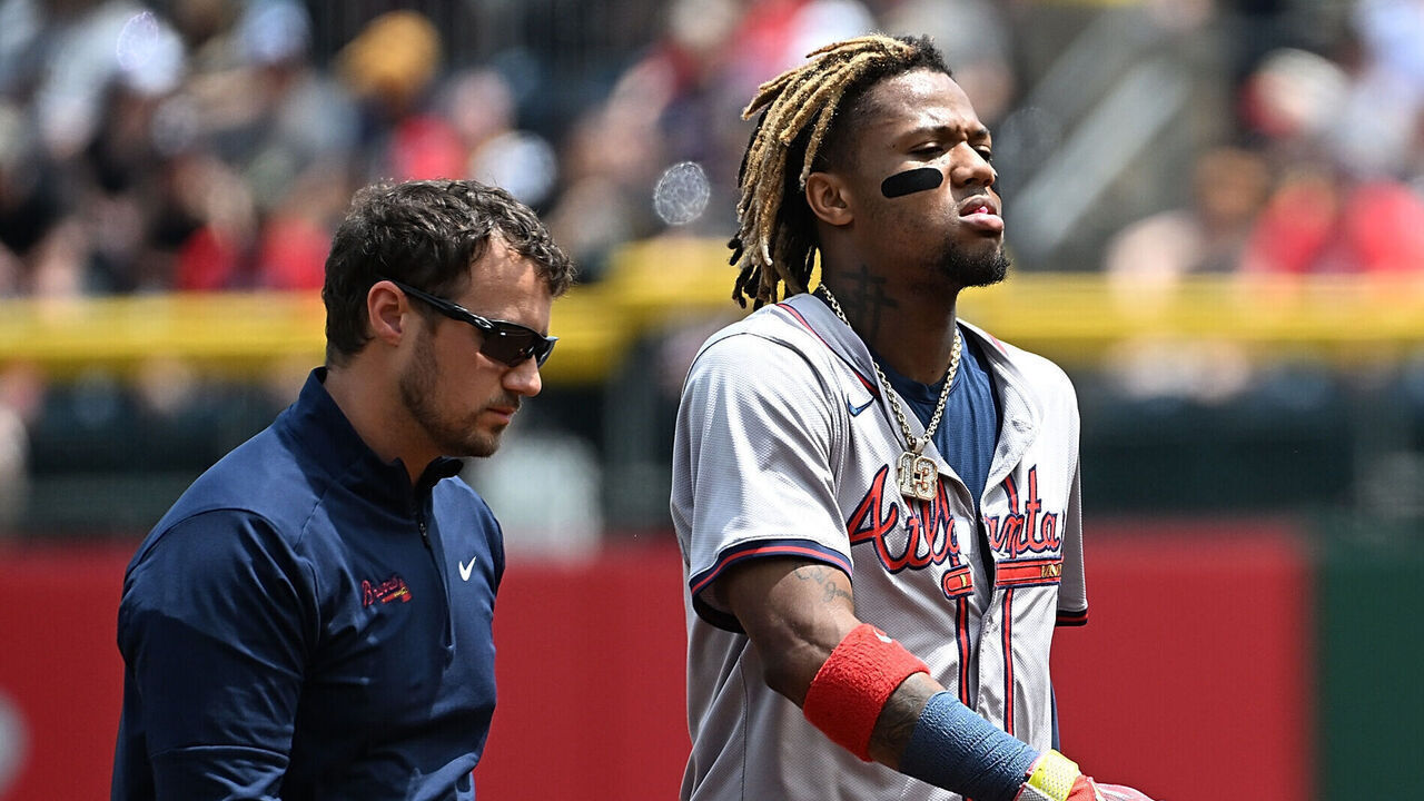 PITTSBURGH, PENNSYLVANIA - MAY 26: Ronald Acuña Jr. #13 of the Atlanta Braves walks off the field with trainers after an apparent injury in the first inning during the game against the Pittsburgh Pirates at PNC Park on May 26, 2024 in Pittsburgh, Pennsylvania.