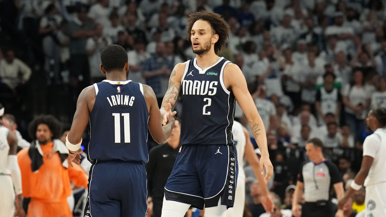 MINNEAPOLIS, MN - MAY 22: Kyrie Irving #11 high fives Dereck Lively II #2 of the Dallas Mavericks during the game against the Minnesota Timberwolves during Game 1 of the Western Conference Finals of the 2024 NBA Playoffs on May 22, 2024 at Target Center in Minneapolis, Minnesota. Mandatory Copyright Notice: Copyright 2024 NBAE