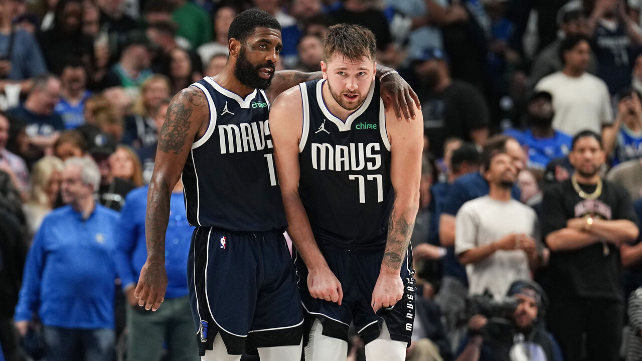 DALLAS, TX - MAY 26: Kyrie Irving #11 embraces Luka Doncic #77 of the Dallas Mavericks during the game against the Minnesota Timberwolves during Game 3 of the Western Conference Finals of the 2024 NBA Playoffs on May 26, 2024 at the American Airlines Center in Dallas, Texas. Mandatory Copyright Notice: Copyright 2024 NBAE