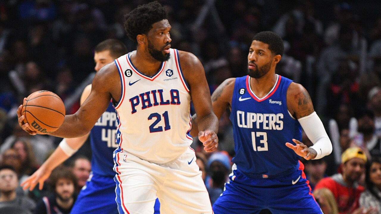 LOS ANGELES, CA - JANUARY 17: Philadelphia 76ers Center Joel Embiid (21) is guarded by Los Angeles Clippers Forward Paul George (13) during a NBA game between the Philadelphia 76ers and the Los Angeles Clippers on January 17, 2023 at Crypto.com Arena in Los Angeles, CA.