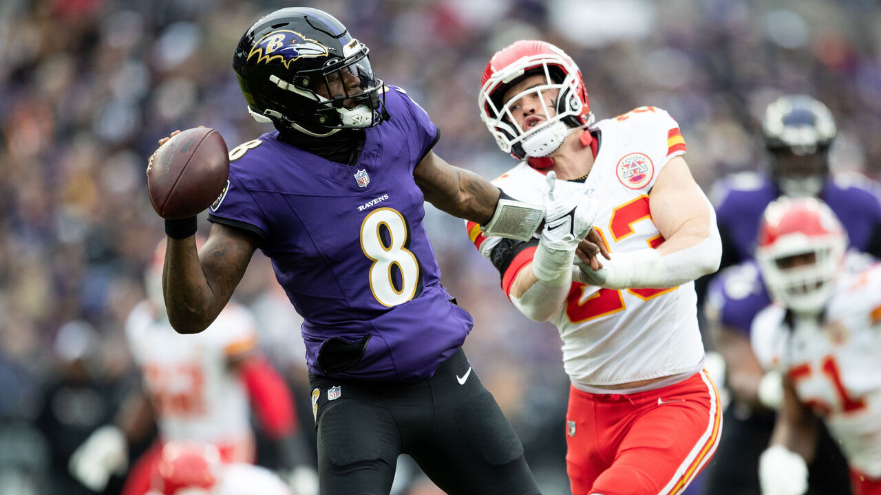 BALTIMORE, MARYLAND - JANUARY 28: Lamar Jackson #8 of the Baltimore Ravens attempts to throw a pass as Drue Tranquill #23 of the Kansas City Chiefs defends during the AFC Championship NFL football game at M&T Bank Stadium on January 28, 2024 in Baltimore, Maryland.