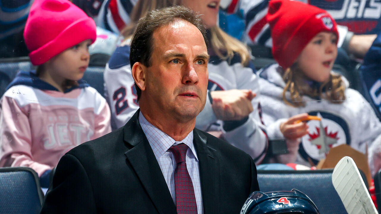 WINNIPEG, CANADA - FEBRUARY 14: Associate coach Scott Arniel of the Winnipeg Jets looks on from the bench prior to NHL action against the San Jose Sharks at Canada Life Centre on February 14, 2024 in Winnipeg, Manitoba, Canada.