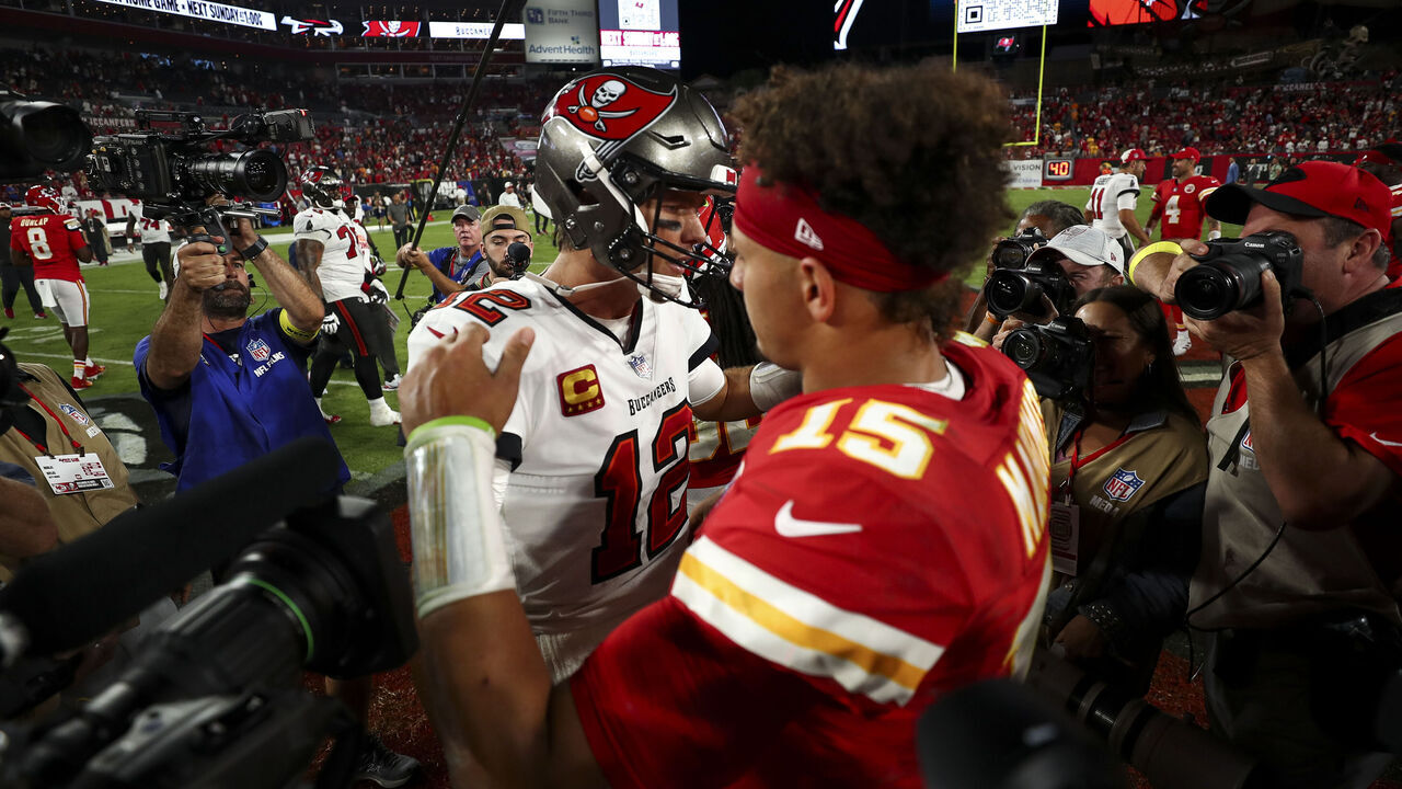 TAMPA, FL - OCTOBER 2: Tom Brady #12 of the Tampa Bay Buccaneers hugs Patrick Mahomes #15 of the Kansas City Chiefs after an NFL football game at Raymond James Stadium on October 2, 2022 in Tampa, Florida.