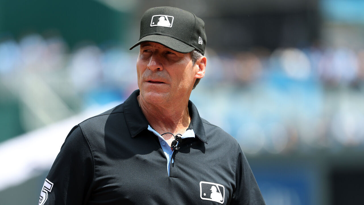 KANSAS CITY, MISSOURI - MAY 08: Umpire Angel Hernandez #5 looks on prior to the game between the Milwaukee Brewers and the Kansas City Royals at Kauffman Stadium on May 08, 2024 in Kansas City, Missouri.