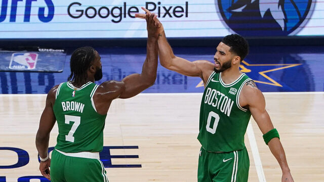 INDIANAPOLIS, INDIANA - MAY 27: (L-R) Jaylen Brown #7 of the Boston Celtics and Jayson Tatum #0 of the Boston Celtics high five during the second quarter in Game Four of the Eastern Conference Finals at Gainbridge Fieldhouse on May 27, 2024 in Indianapolis, Indiana.