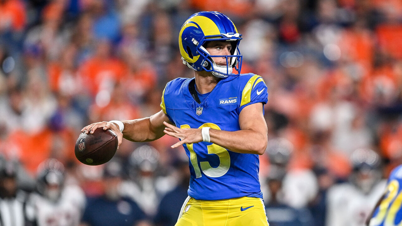 DENVER, COLORADO - AUGUST 26: Quarterback Stetson Bennett #13 of the Los Angeles Rams passes against the Denver Broncos in the first quarter of a preseason game at Empower Field at Mile High on August 26, 2023 in Denver, Colorado.