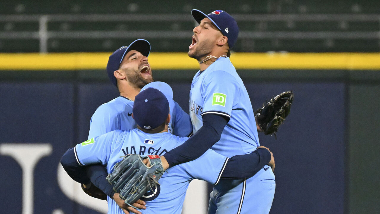 CHICAGO, ILLINOIS - MAY 28: (L-R) Kevin Kiermaier #39, Daulton Varsho #25, and George Springer #4 of the Toronto Blue Jays celebrate the end of their team's win over the Chicago White Sox at Guaranteed Rate Field on May 28, 2024 in Chicago, Illinois. The Blue Jays defeated the White Sox 7-2.