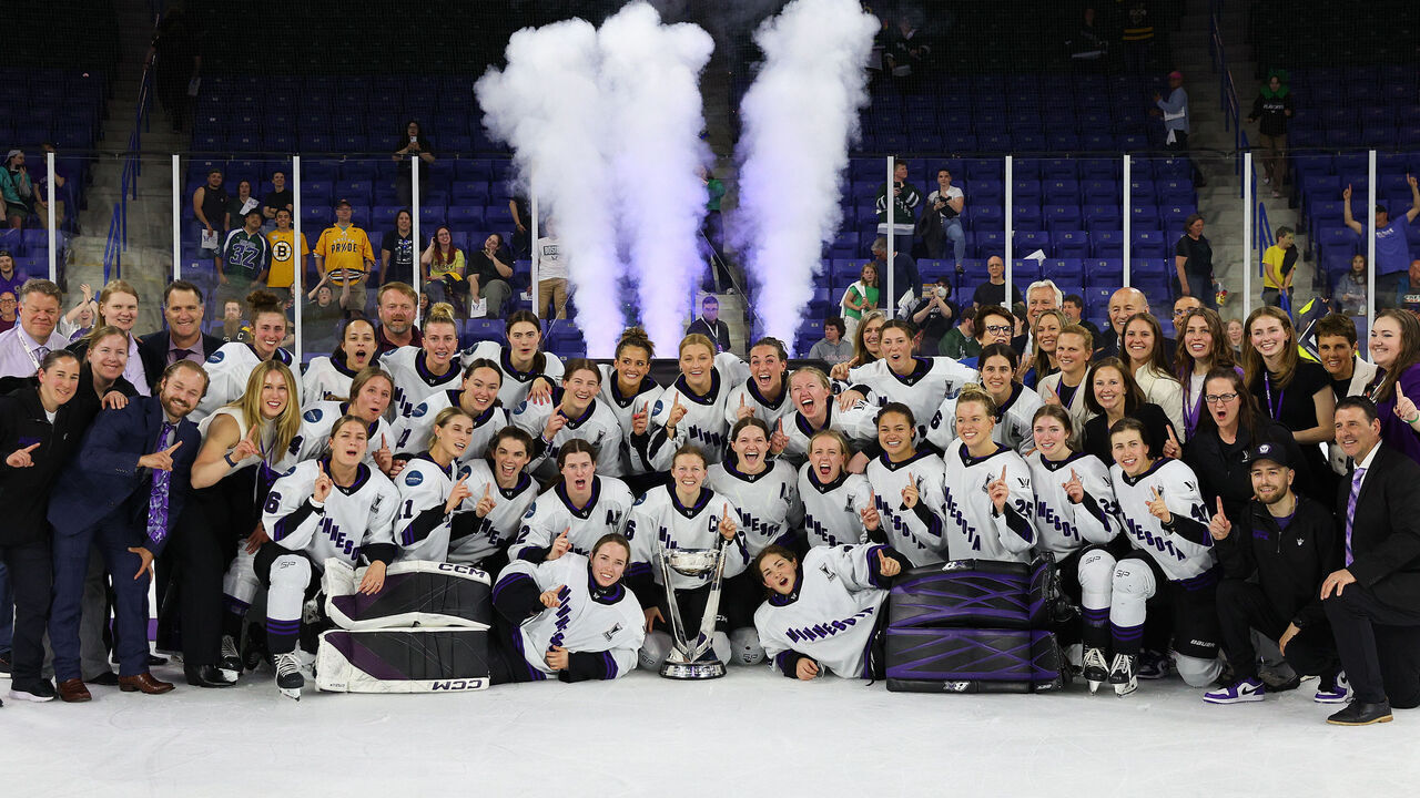 LOWELL, MA - MAY 29: Minnesota players pose for pictures after defeating Boston in game 5 of the PWHL Walter Cup Finals on May 29, 2024, at Tsongas Center in Lowell, MA.