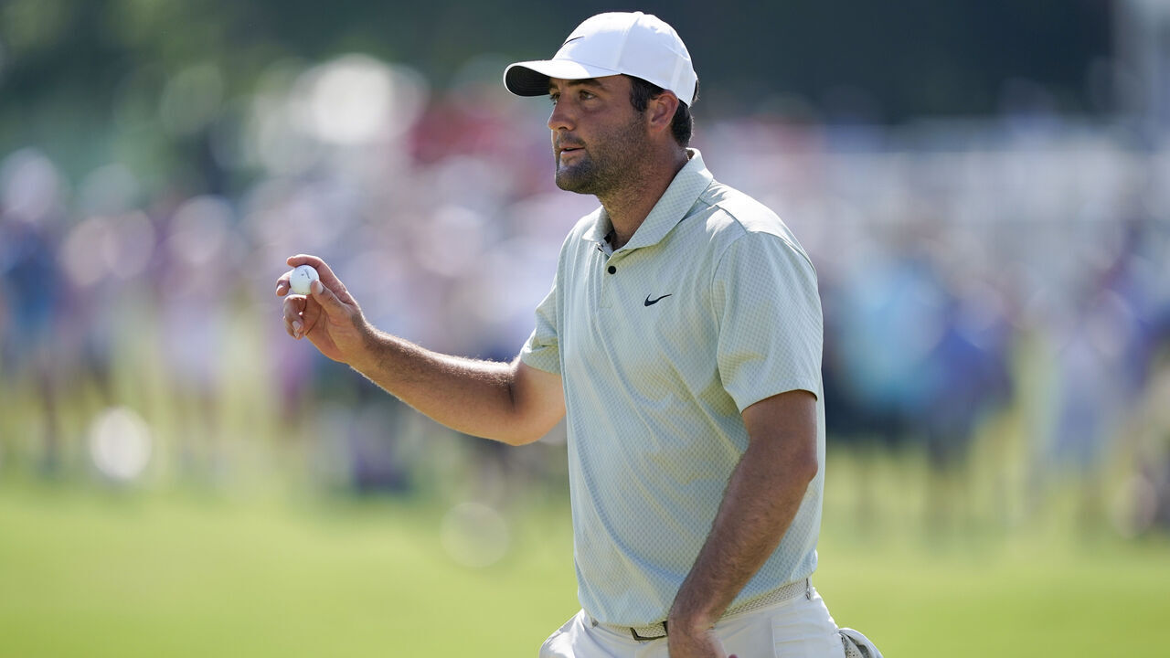 FORT WORTH, TEXAS - MAY 26: Scottie Scheffler of the United States acknowledges fans after a putt on the 18th green during the final round of the Charles Schwab Challenge at Colonial Country Club on May 26, 2024 in Fort Worth, Texas.