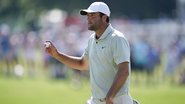 FORT WORTH, TEXAS - MAY 26: Scottie Scheffler of the United States acknowledges fans after a putt on the 18th green during the final round of the Charles Schwab Challenge at Colonial Country Club on May 26, 2024 in Fort Worth, Texas.