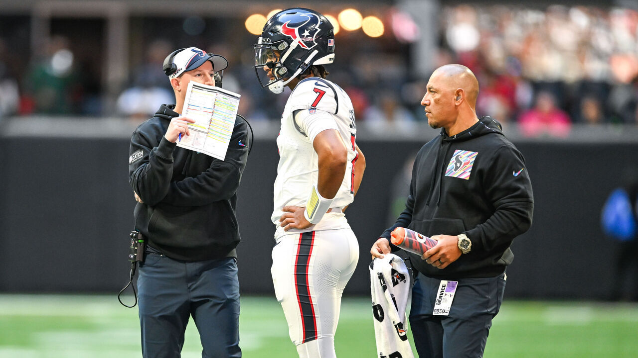 ATLANTA, GA OCTOBER 08: Houston quarterback C.J. Stroud (7) talks with offensive coordinator Bobby Slowik during the NFL game between the Houston Texans and the Atlanta Falcons on October 8th, 2023 at Mercedes-Benz Stadium in Atlanta, GA.