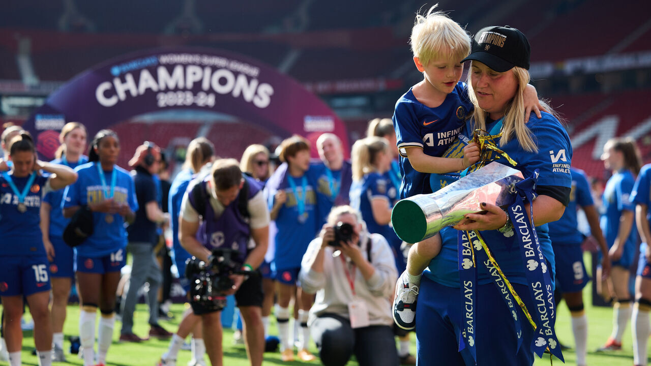 MANCHESTER, ENGLAND - MAY 18: Emma Hayes Manager of Chelsea FC and her son celebrates her team winning the League after the Barclays Womens Super League match between Manchester United and Chelsea FC at Old Trafford on May 18, 2024 in Manchester, England.