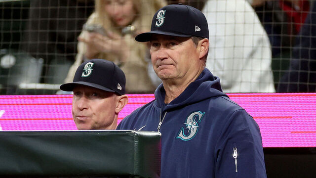 SEATTLE, WASHINGTON - APRIL 29: Bench Coach & Offensive Coordinator Brant Brown #73 and manager Scott Servais #9 of the Seattle Mariners talk during the first inning against the Atlanta Braves at T-Mobile Park on April 29, 2024 in Seattle, Washington.