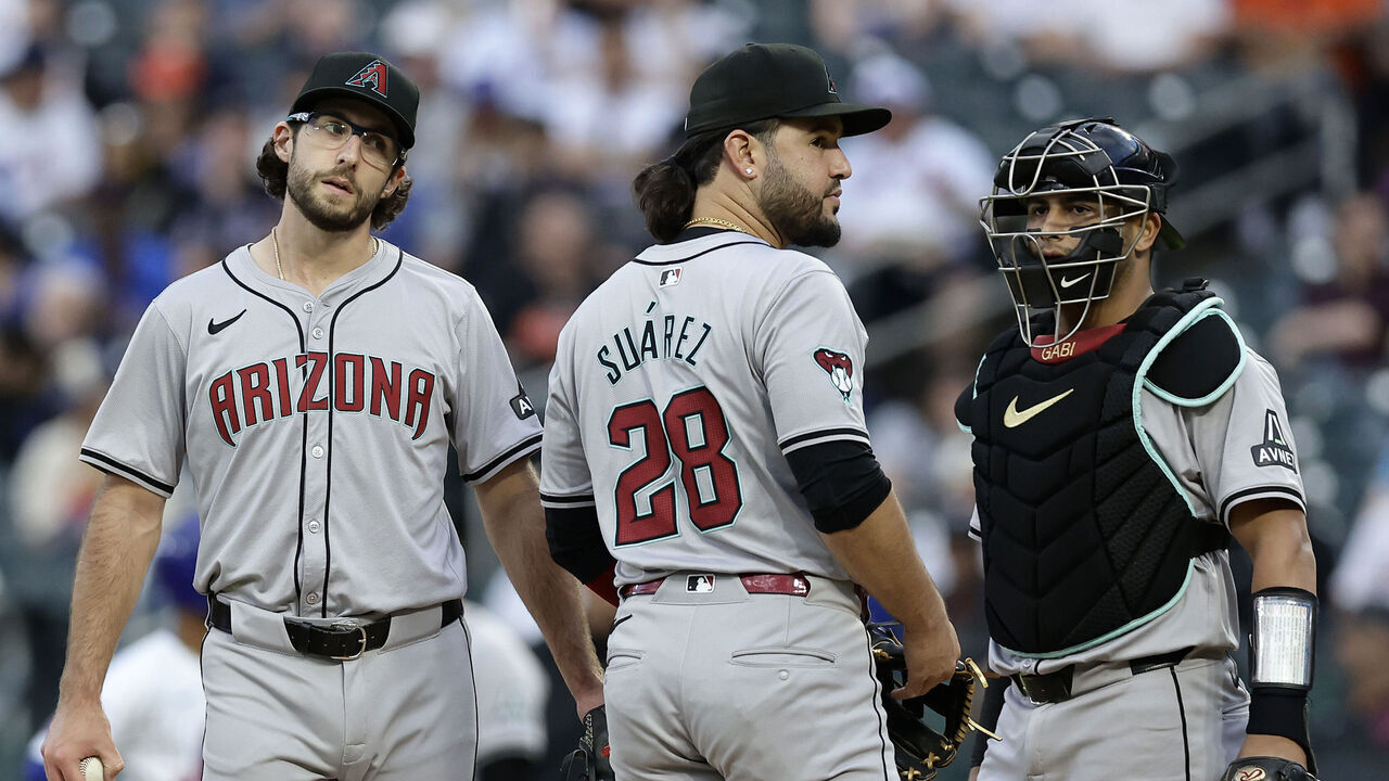 NEW YORK, NEW YORK - MAY 30: Zac Gallen #23 of the Arizona Diamondbacks looks on from the mound with teammates Eugenio Suarez #28 and catcher Gabriel Moreno #14 prior to leaving a game against the New York Mets in the first inning at Citi Field on May 30, 2024 in New York City.