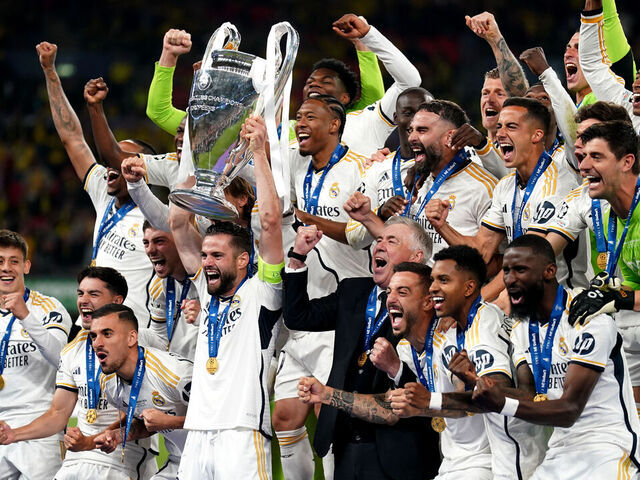 Real Madrid's Nacho Fernandez lifts the trophy as he celebrates winning the UEFA Champions League final with manager Carlo Ancelotti and team-mates at Wembley Stadium in London. Picture date: Saturday June 1, 2024.