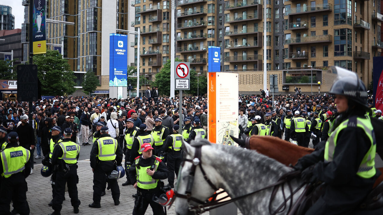 Mounted police control the crowds close to kick-off outside Wembley stadium, in London, on June 1, 2024 ahead of the UEFA Champions League final football match between Borussia Dortmund and Real Madrid.