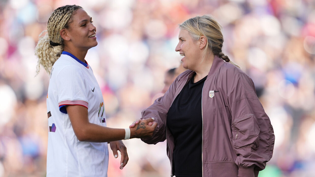 COMMERCE CITY, COLORADO - JUNE 01: United States head coach Emma Hayes shakes hands with Trinity Rodman #22 during the second half against the Korea Republic at Dick's Sporting Goods Park on June 01, 2024 in Commerce City, Colorado.