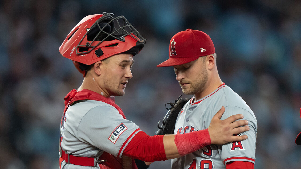 SEATTLE, WA - JUNE 01: Starting pitcher Reid Detmers #48 of the Los Angeles Angels meets at the mound with catcher Matt Thaiss #21 and first baseman Willie Calhoun #5 during the fourth inning of a game against the Seattle Mariners at T-Mobile Park on June 1, 2024 in Seattle, Washington.