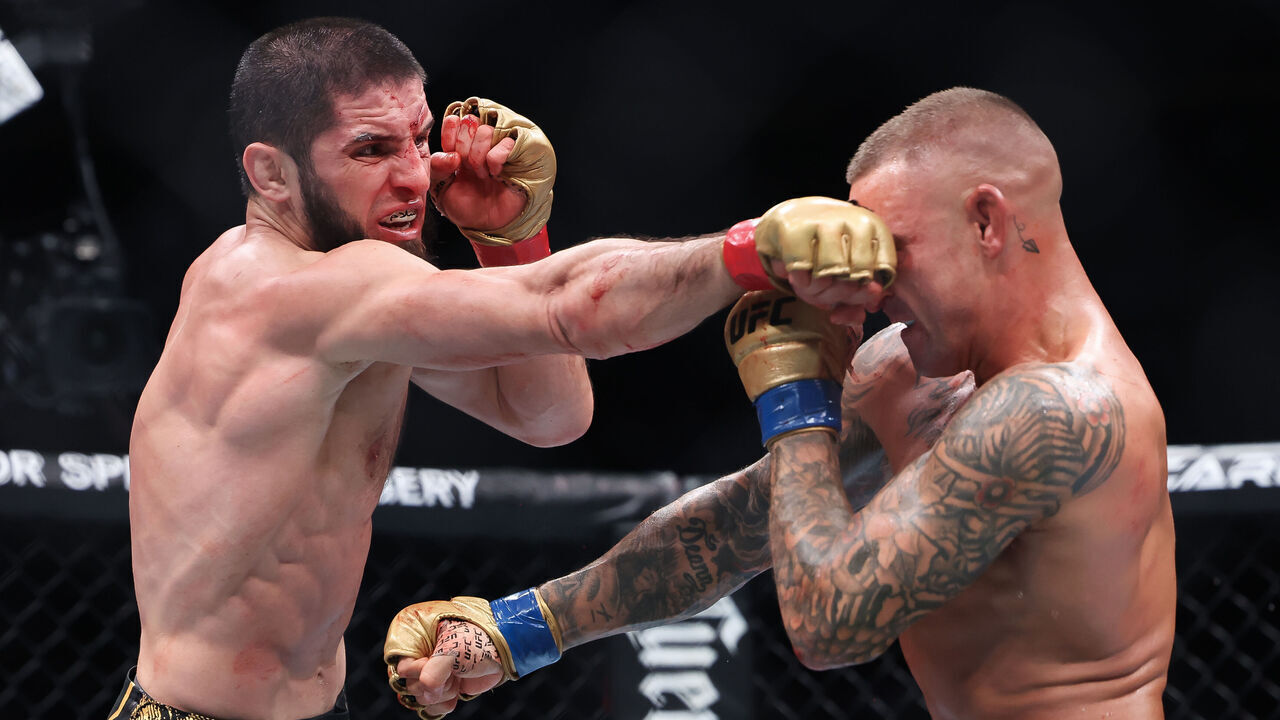 NEWARK, NEW JERSEY - JUNE 01: (R-L) Dustin Poirier and Islam Makhachev of Russia exchange strikes in their lightweight title bout during UFC 302 at Prudential Center on June 01, 2024 in Newark, New Jersey.