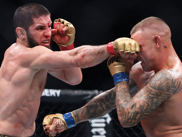 NEWARK, NEW JERSEY - JUNE 01: (R-L) Dustin Poirier and Islam Makhachev of Russia exchange strikes in their lightweight title bout during UFC 302 at Prudential Center on June 01, 2024 in Newark, New Jersey.