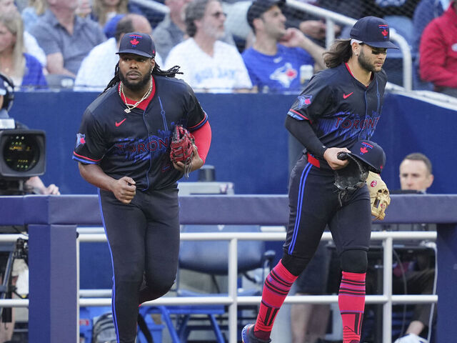 TORONTO, ON - MAY 31: Vladimir Guerrero Jr. #27 and Bo Bichette #11 of the Toronto Blue Jays take the field against the Pittsburgh Pirates in their MLB game at the Rogers Centre on May 31, 2024 in Toronto, Ontario, Canada.