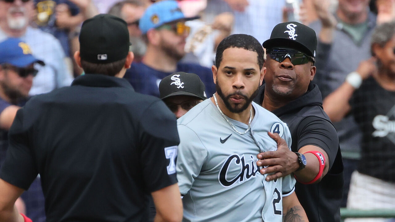 MILWAUKEE, WISCONSIN - JUNE 02: Tommy Pham #28 of the Chicago White Sox is restrained by coaches during the eighth inning against the Milwaukee Brewers at American Family Field on June 02, 2024 in Milwaukee, Wisconsin.