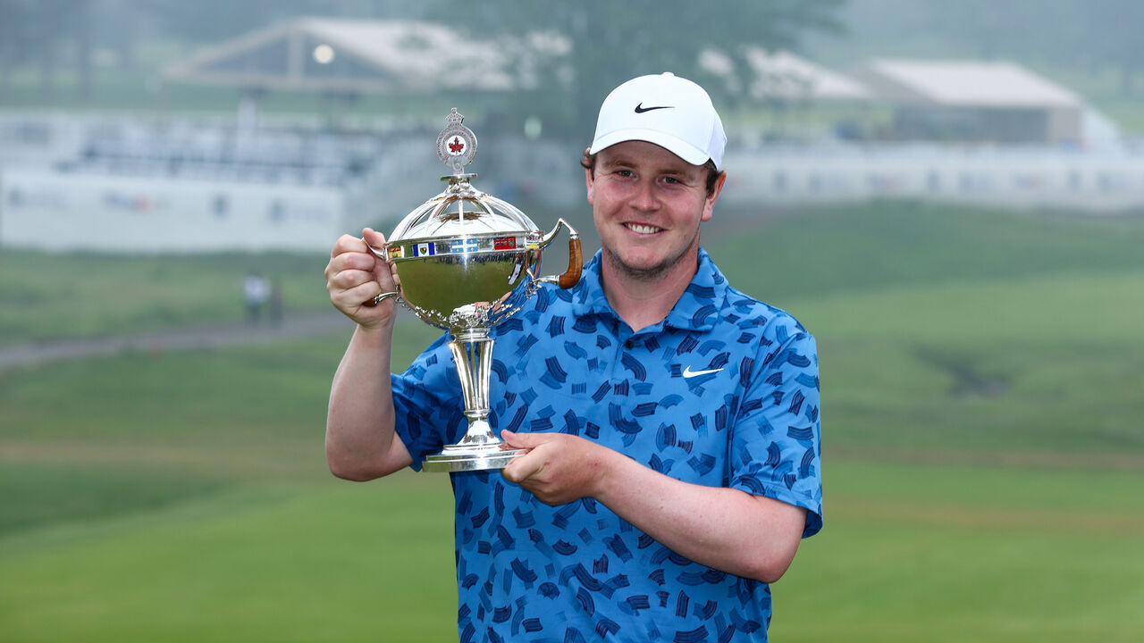 HAMILTON, ONTARIO - JUNE 02: Robert MacIntyre of Scotland celebrates with the trophy after winning the final round of the RBC Canadian Open at Hamilton Golf & Country Club on June 02, 2024 in Hamilton, Ontario, Canada.